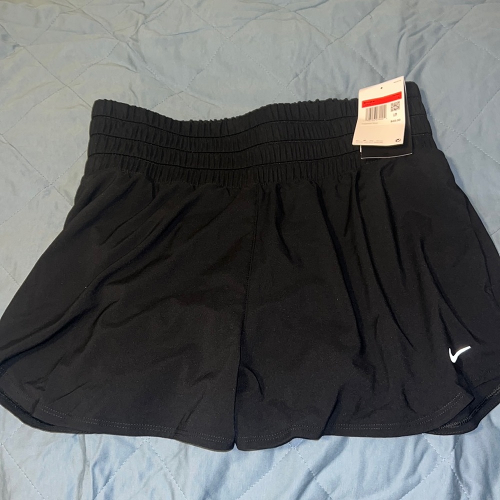 New with tags high rise black nike shorts. Size large. Has pockets!